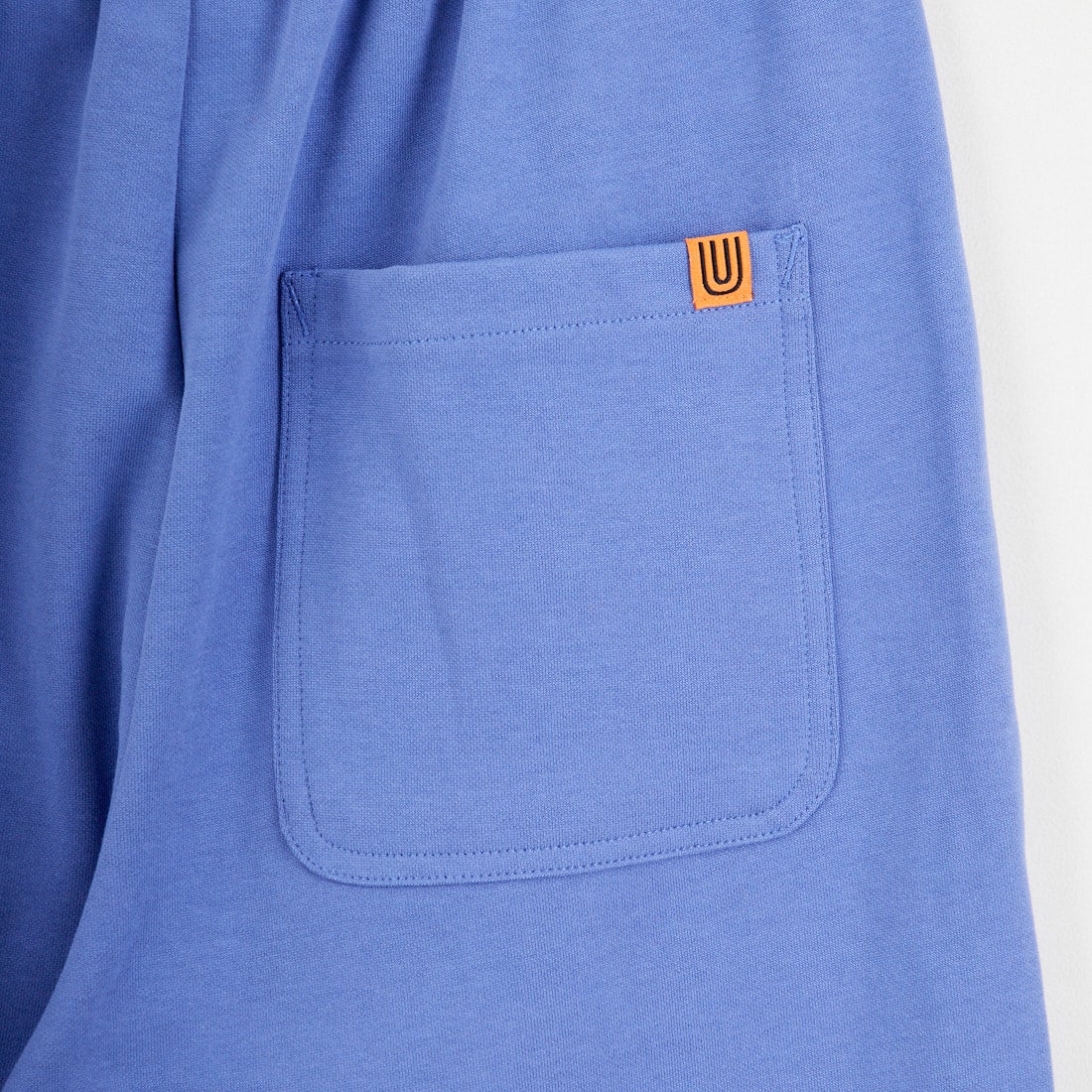 UNIVERSAL OVERALL [ユニバーサルオーバーオール] 別注 ポンチスウェットイージーパンツ [U2422601IN-JF] BLUE