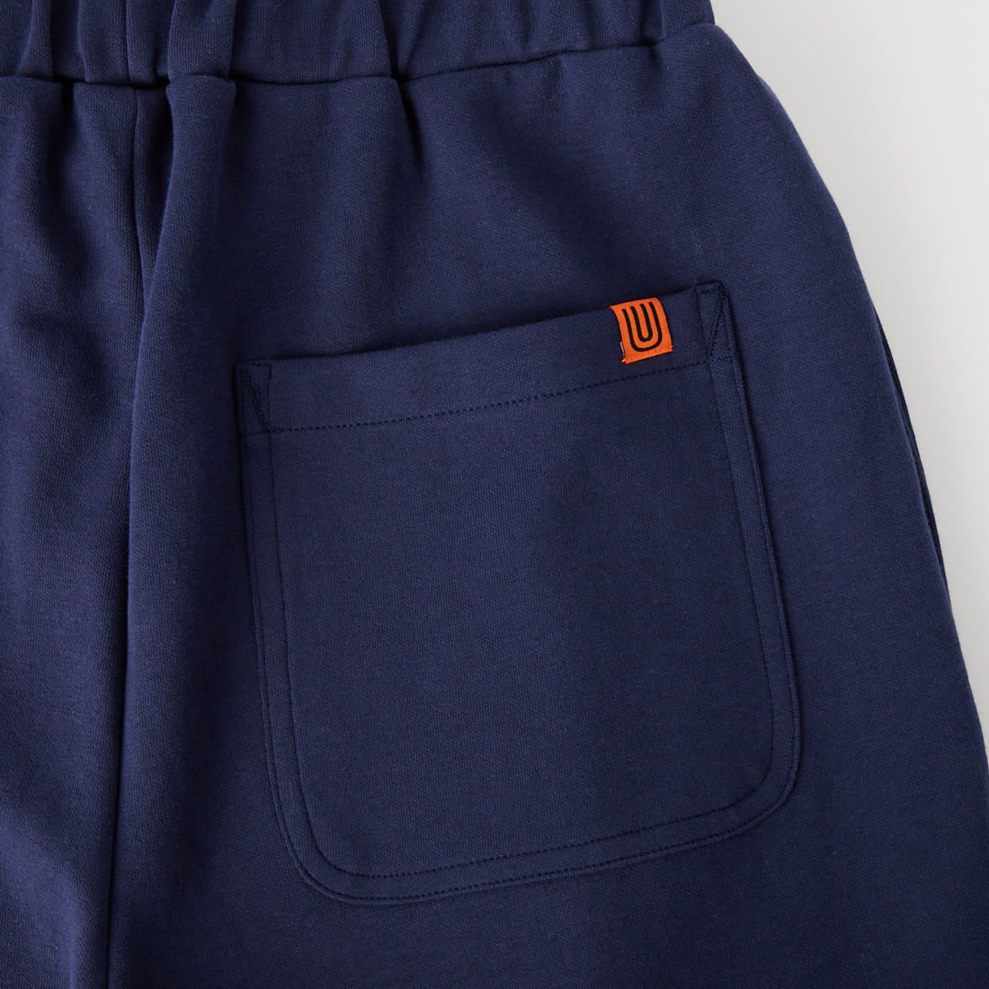 UNIVERSAL OVERALL [ユニバーサルオーバーオール] 別注 ポンチスウェットイージーパンツ [U2422601IN-JF] NAVY