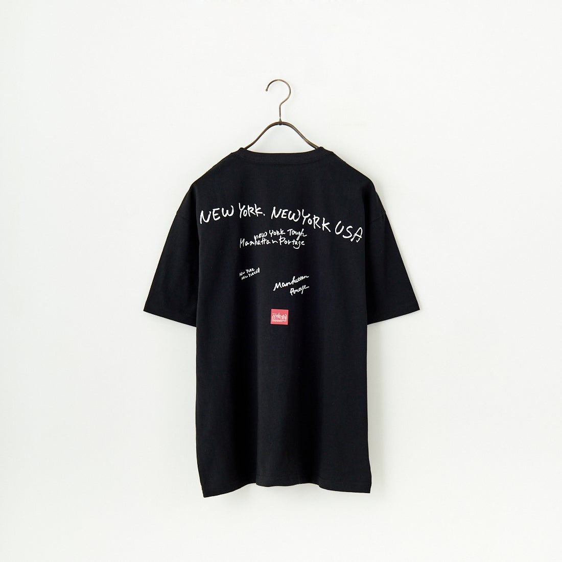 MANHATTAN PORTAGE [マンハッタンポーテージ] 別注 ランダムロゴ バックプリントTシャツ [25SSMP-IN66-JF] BLACK