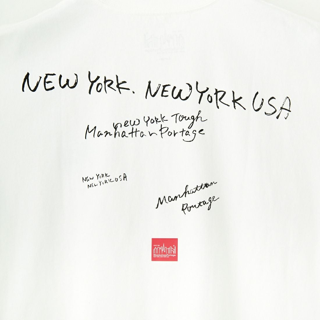 MANHATTAN PORTAGE [マンハッタンポーテージ] 別注 ランダムロゴ バックプリントTシャツ [25SSMP-IN66-JF] WHITE