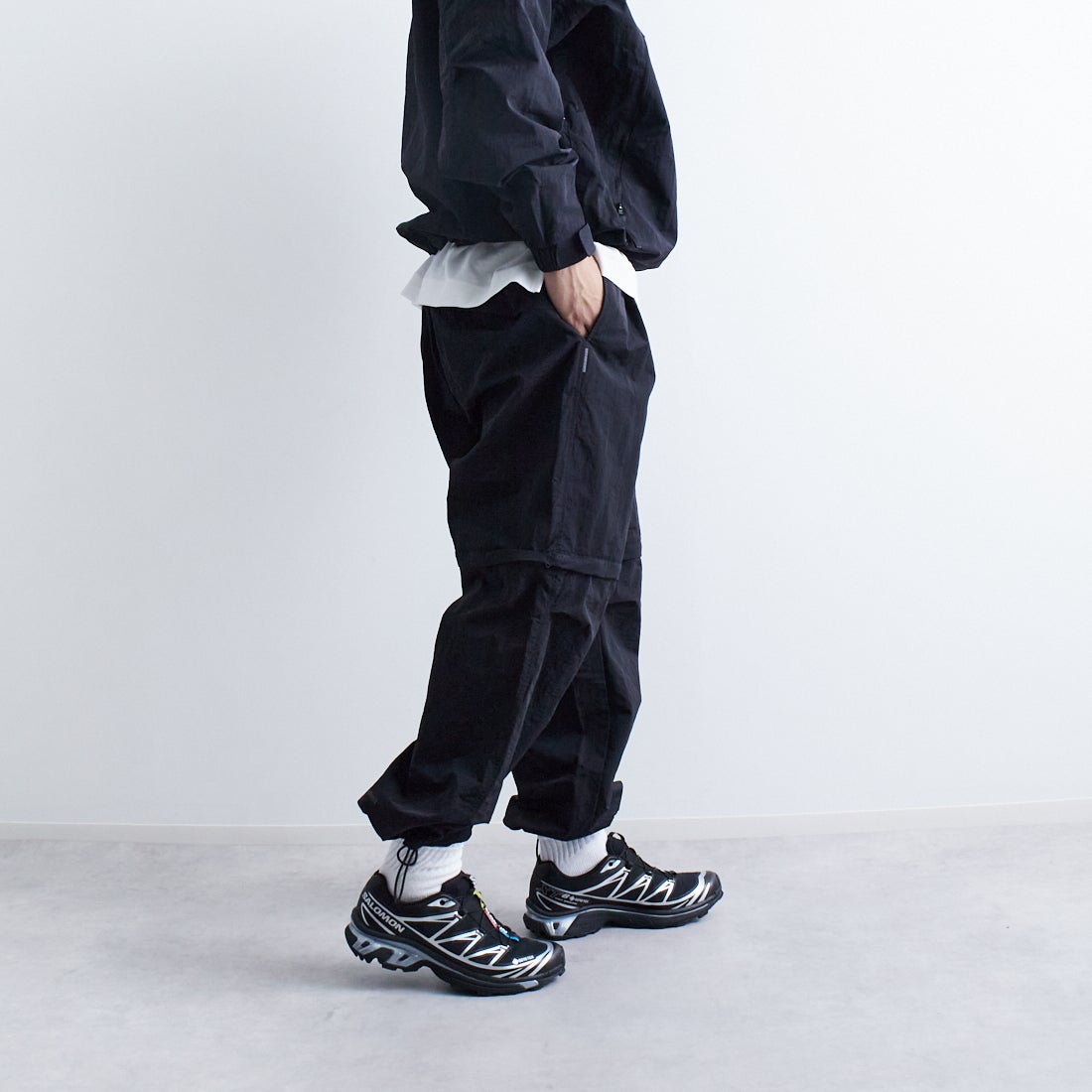 +phenix [プラスフェニックス] 別注 2WAY ナイロンタッサーコンバーチブルパンツ [POB-25007IN-JF] BLACK &&モデル身長：179cm 着用サイズ：L&&