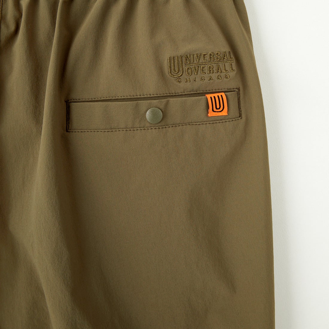 UNIVERSAL OVERALL [ユニバーサルオーバーオール] 別注 ストレッチナイロンイージーパンツ [U2513606IN-JF] OLIVE