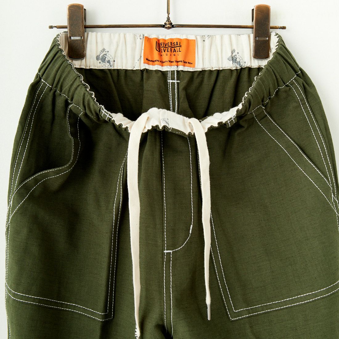UNIVERSAL OVERALL [ユニバーサルオーバーオール] 別注 リネンイージーベイカーパンツ [U2512605IN-JF] OLIVE