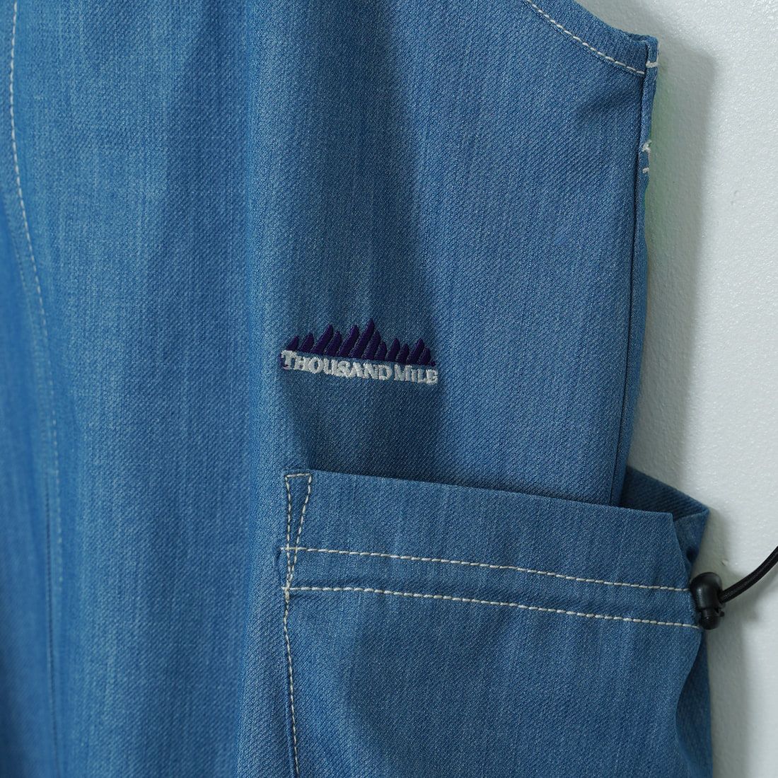 THOUSAND MILE [サウザンド マイル] フロントジップ サロペットワンピース [TM251TD00342] LT.BLUE