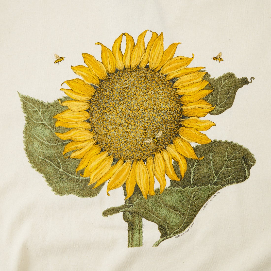 LIBERTY GRAPHICS [リバティーグラフィックス] サンフラワー&ビープリントTシャツ [SUNFLOWER-AND-BEES] NATURAL