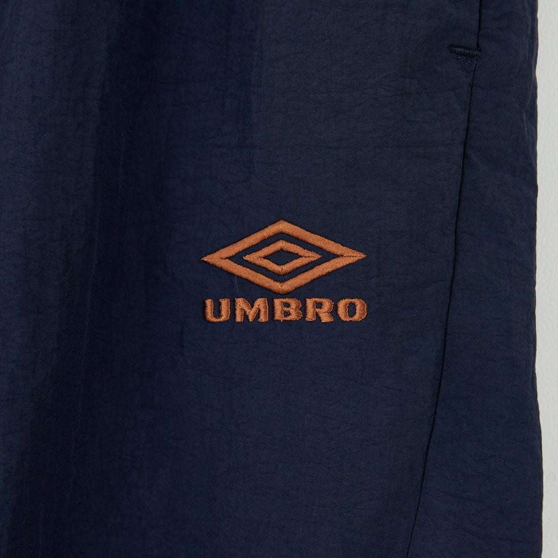 UMBRO [アンブロ] 別注 ナイロントラックパンツ [KBT126-NK-PT1-MS-JF] NAVY