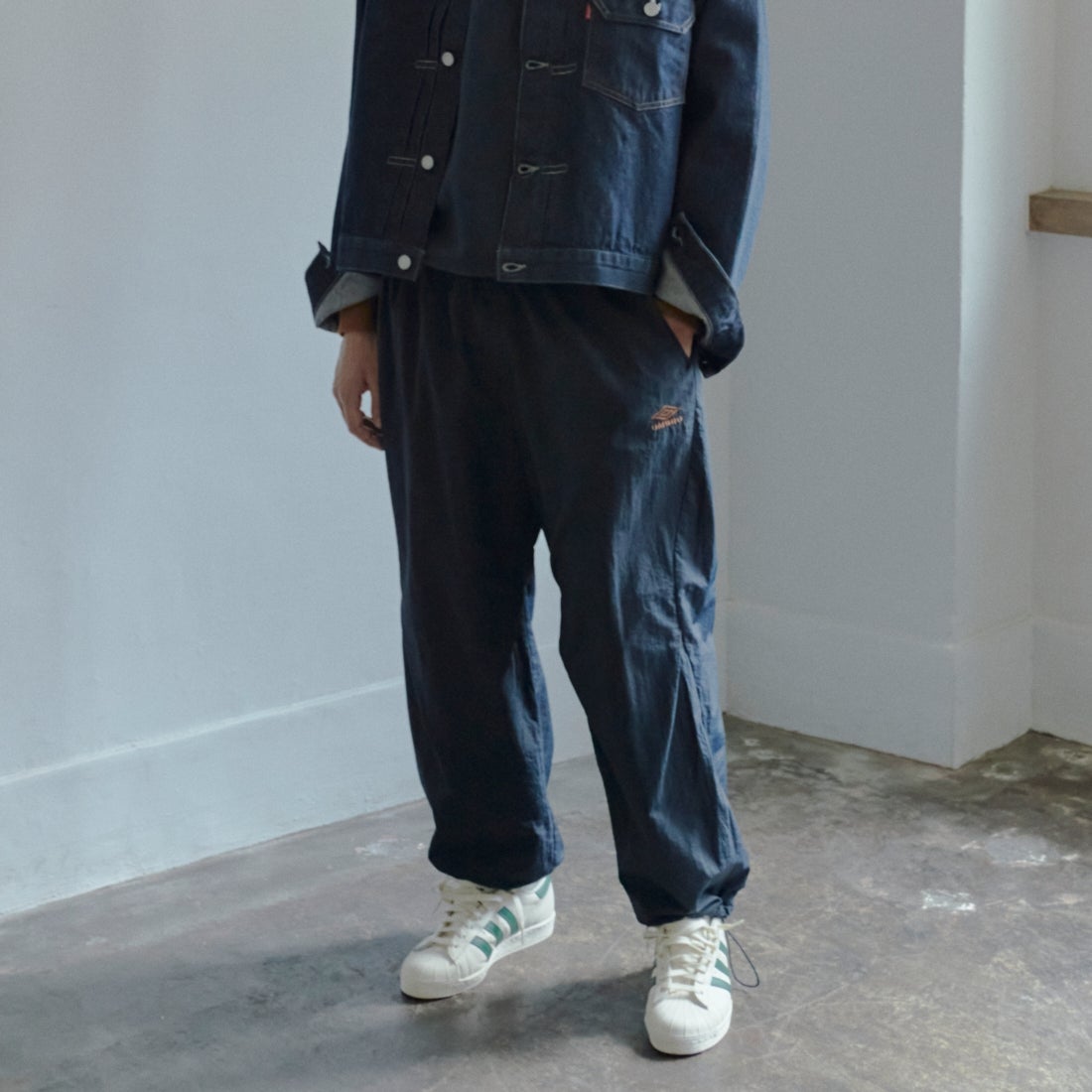 UMBRO [アンブロ] 別注 ナイロントラックパンツ [KBT126-NK-PT1-MS-JF] NAVY