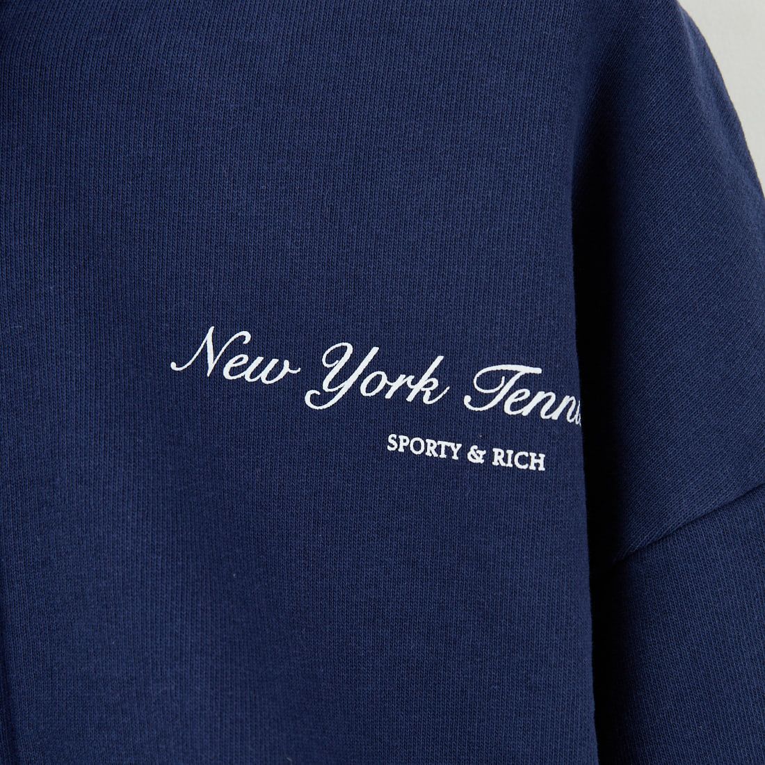 Sporty&Rich [スポーティアンドリッチ] NY テニスクラブ クロップドジップフーディ [ST068621402] DK.NAVY