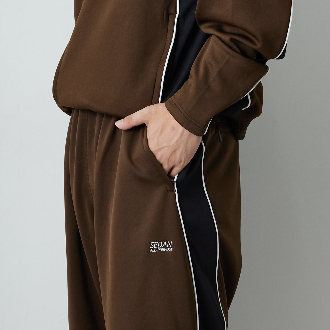 SEDAN ALL-PURPOSE [セダン オールパーパス] OGロゴ トラックパンツ [SD25F-PT05] BRN/BLK