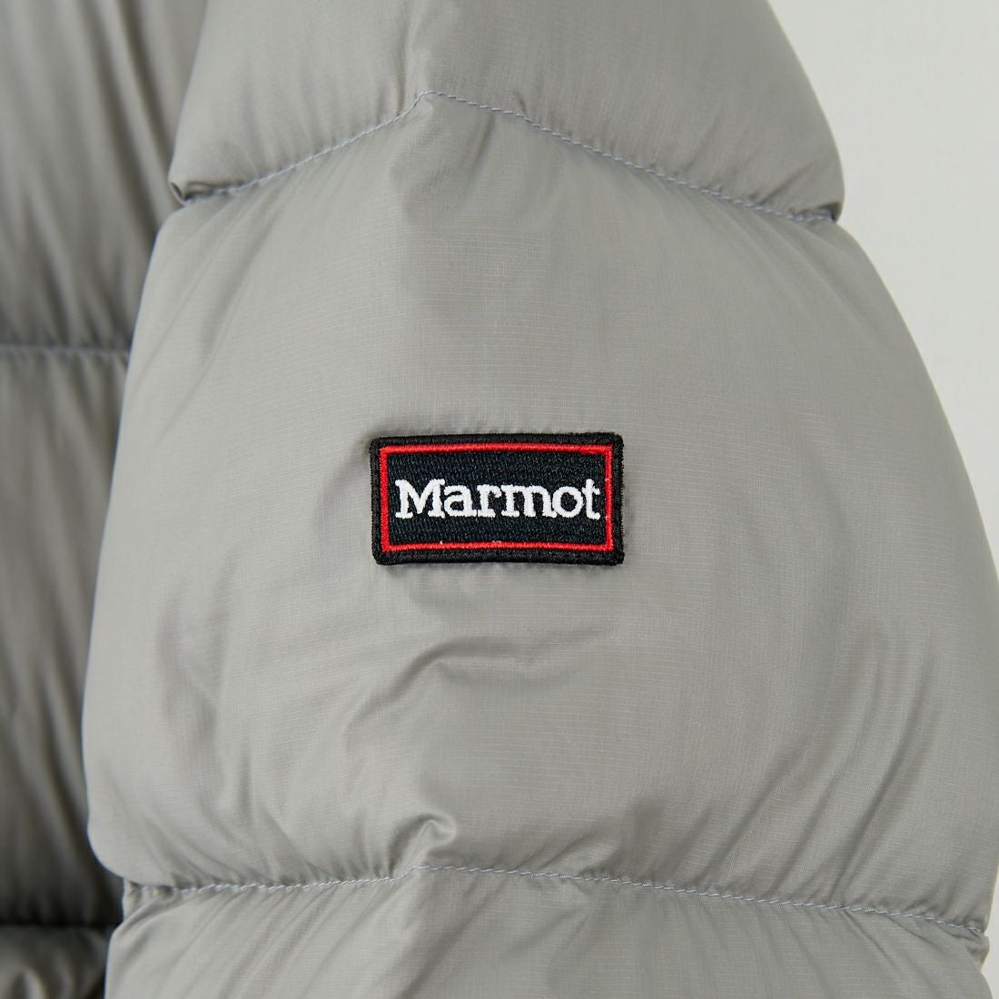 Marmot [マーモット] 別注 ワンポイントロゴ ダウンジャケット [MTFW25UDW329IN-JF] GRAY