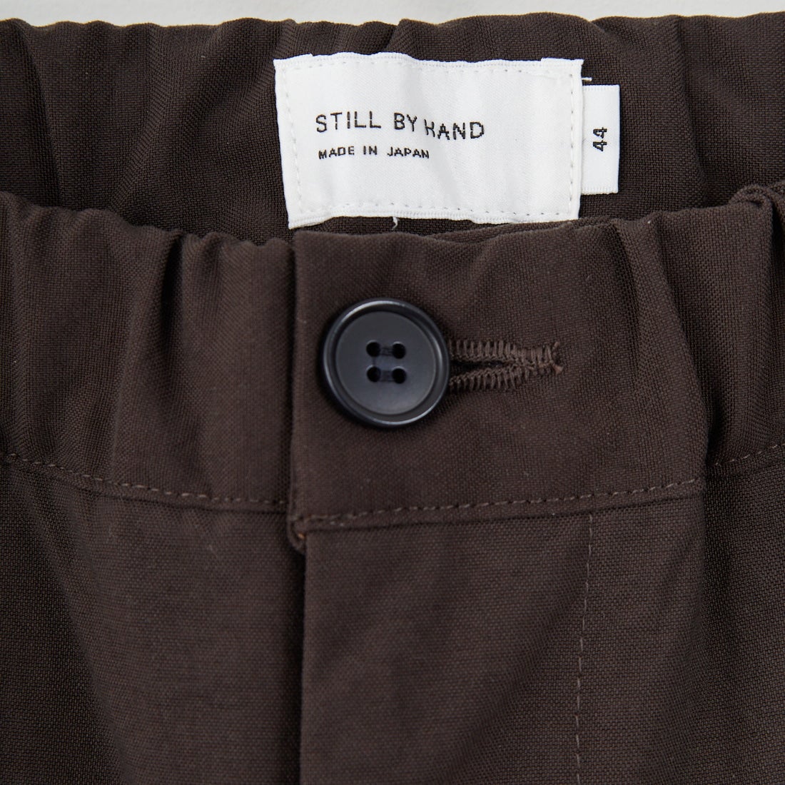 STILL BY HAND [スティルバイハンド] 別注 ナイロンオックステーパードパンツ [2503JF-EX07-JF] BROWN
