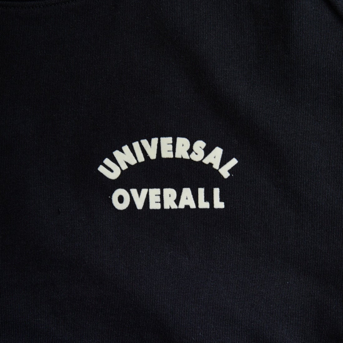UNIVERSAL OVERALL [ユニバーサルオーバーオール] 別注 ワンポイントロゴ刺繍 ラグランスリーブスウェット [U2532201IN-JF] BLACK