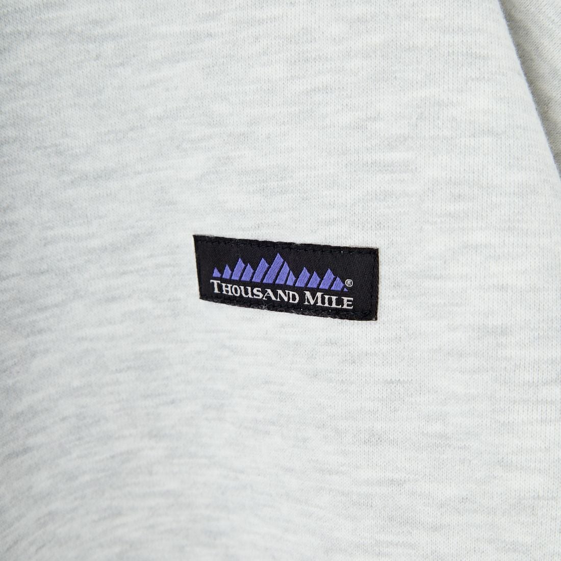 THOUSAND MILE [サウザンド マイル] 別注 ワンポイントロゴ クルーネックスウェット [TM252UK50510-JF] 11 LT.GRAY