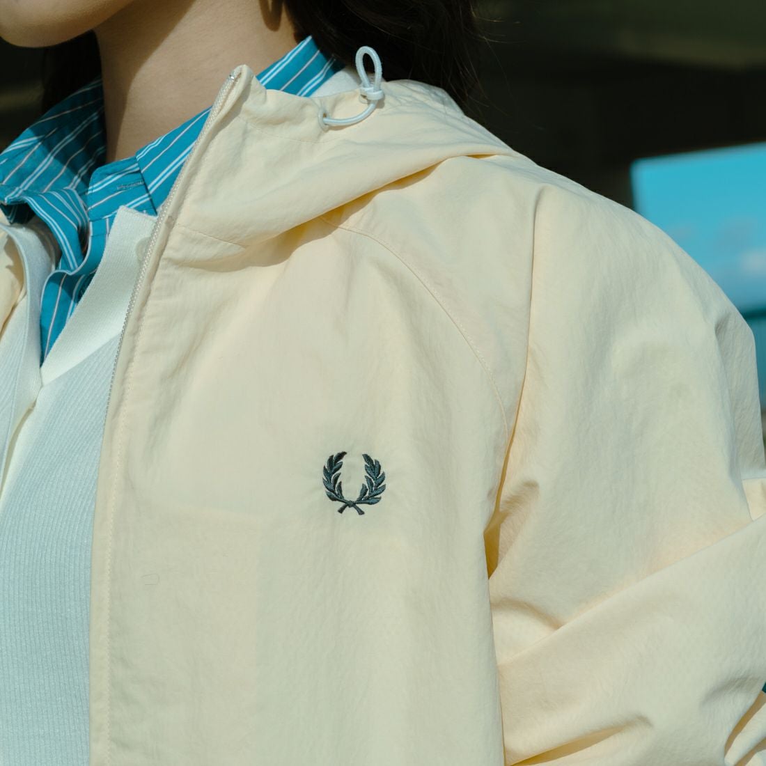 FRED PERRY [フレッドペリー] 別注 フード刺繍 ナイロンシェルジャケット [FPM-25A-031JF] ECRU/ANCHO