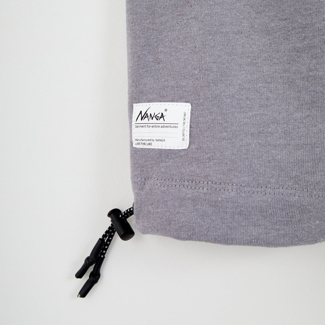 JEANSFACTORY × NANGA [ジーンズファクトリー × ナンガ] 別注 ルーズフィット ドローコードポケットTシャツ [NW26SS-JF5] CHARCOAL