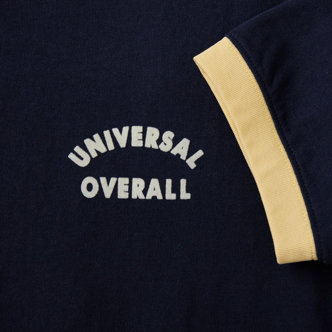 UNIVERSAL OVERALL [ユニバーサルオーバーオール] 別注 ロゴプリント リンガーTシャツ [U2613209IN-JF] NAVY