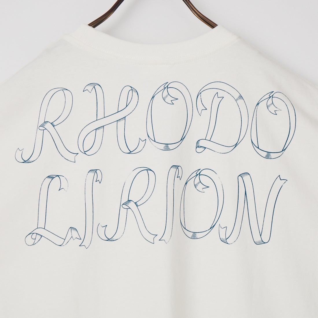 RhodolirioN [ロドリリオン] PRINTED MAKING A BOW WITH RIBBON TEE [SW1058] A WHITE