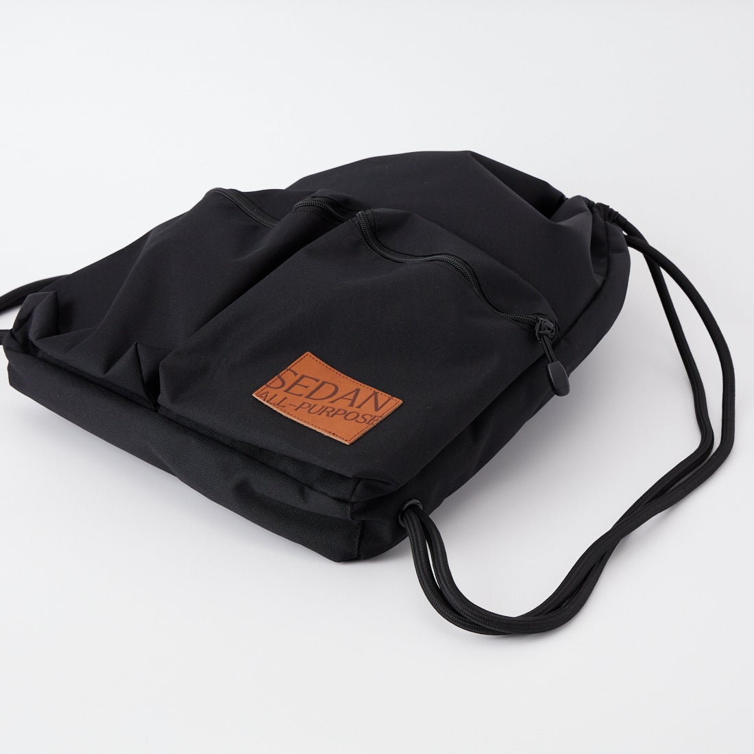 SEDAN ALL-PURPOSE [セダン オールパーパス] ドローストリング ナップサック [SD26S-BG03] BLACK