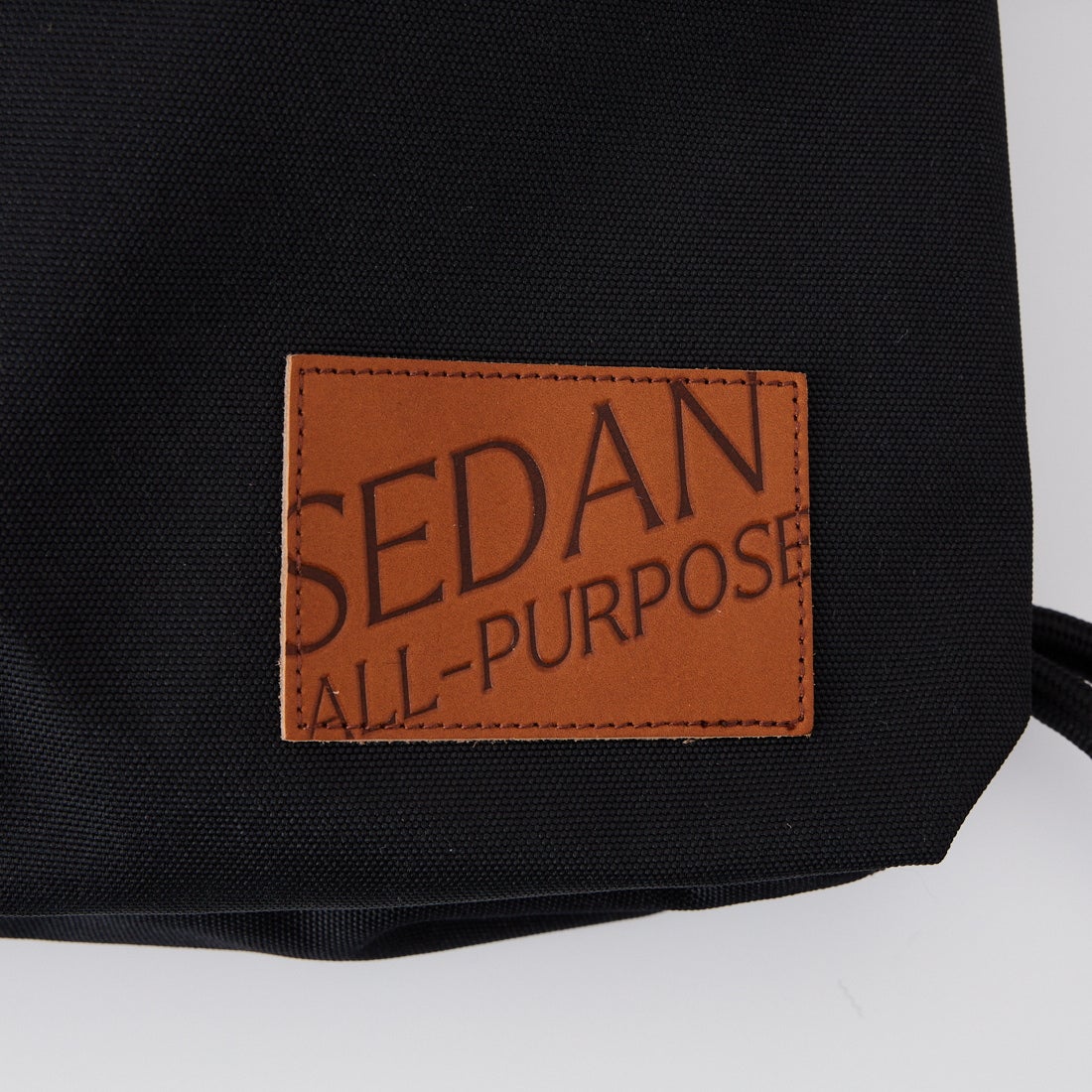 SEDAN ALL-PURPOSE [セダン オールパーパス] ドローストリング ナップサック [SD26S-BG03] BLACK