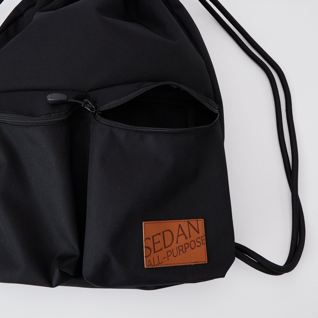 SEDAN ALL-PURPOSE [セダン オールパーパス] ドローストリング ナップサック [SD26S-BG03] BLACK