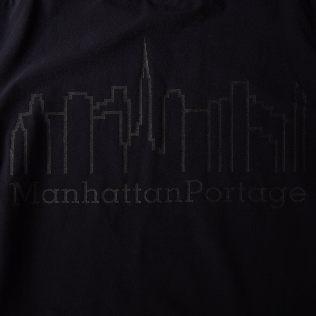 MANHATTAN PORTAGE [マンハッタンポーテージ] 別注 4WAYストレッチ バックプリントTシャツ [26SSMP-IN77-JF] BLACK
