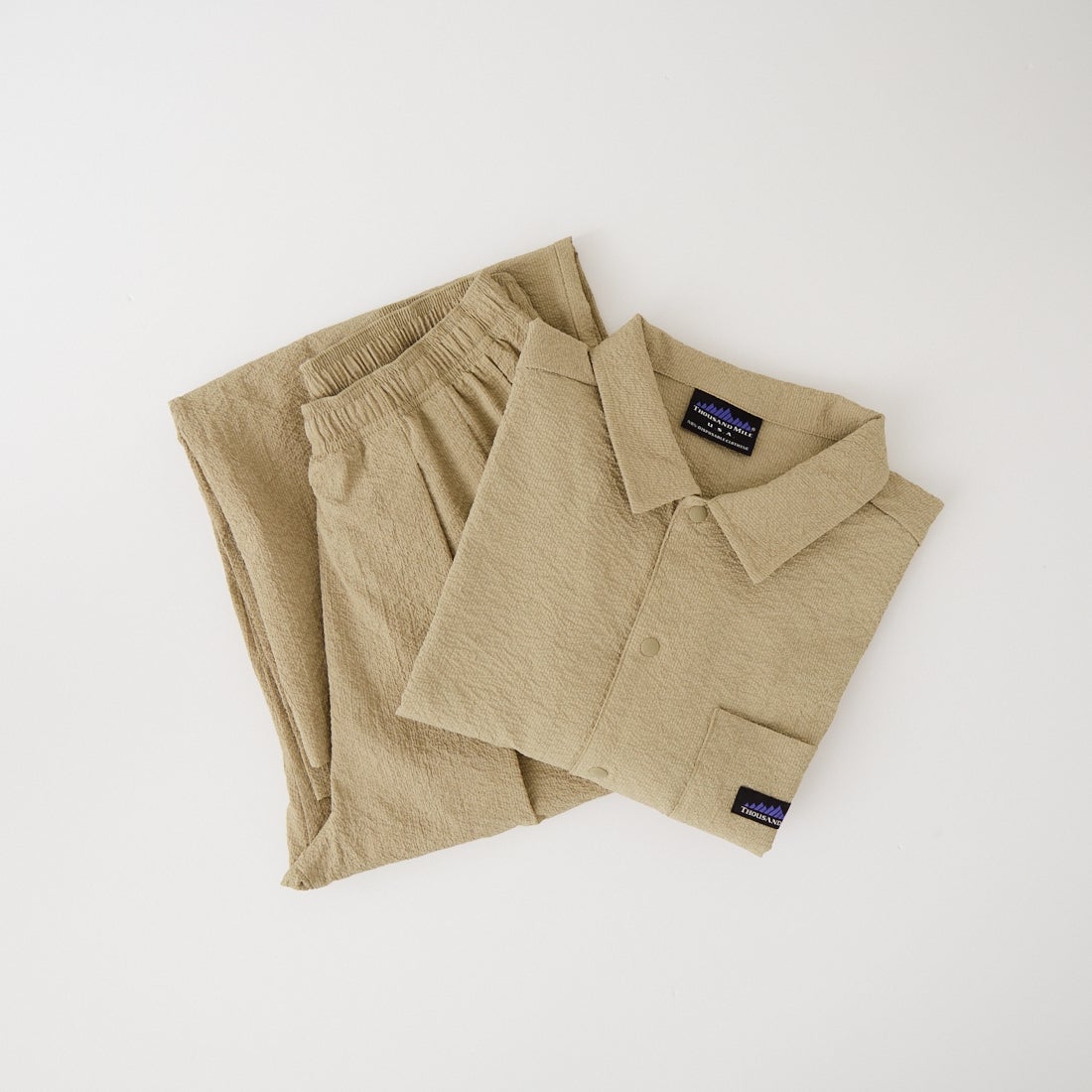 THOUSAND MILE [サウザンド マイル] 別注 シアサッカー サマーバケーション ワイドパンツセットアップ [TM261SS50812-JF] 23 BEIGE