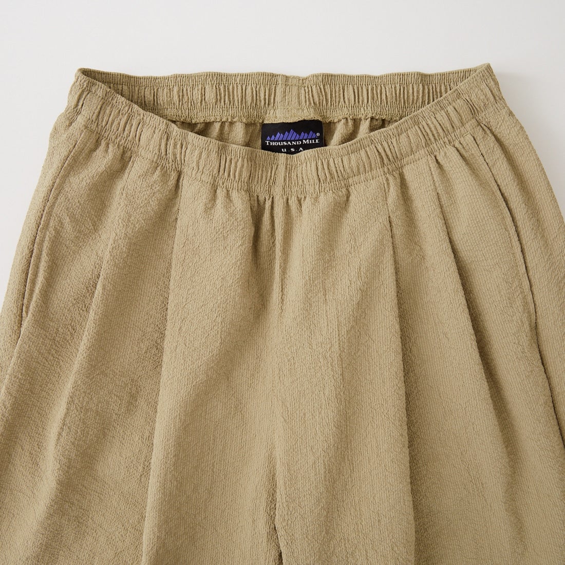 THOUSAND MILE [サウザンド マイル] 別注 シアサッカー サマーバケーション ワイドパンツセットアップ [TM261SS50812-JF] 23 BEIGE