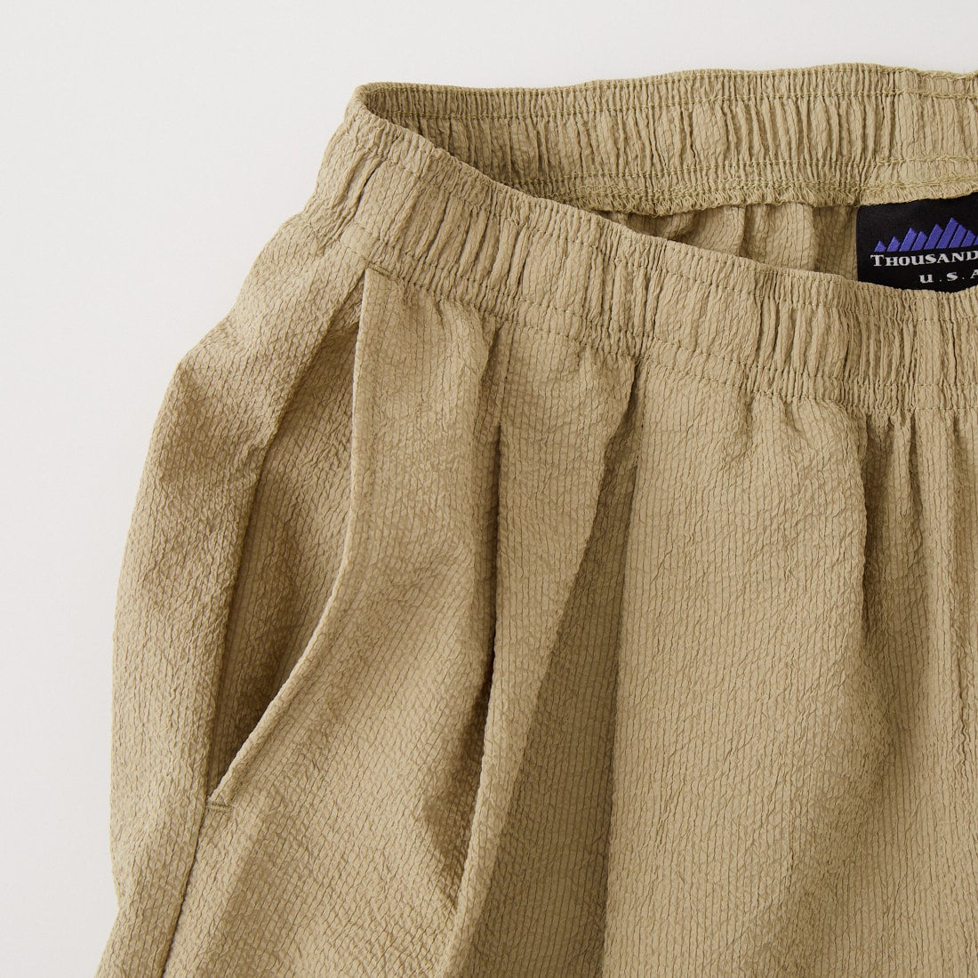 THOUSAND MILE [サウザンド マイル] 別注 シアサッカー サマーバケーション ワイドパンツセットアップ [TM261SS50812-JF] 23 BEIGE