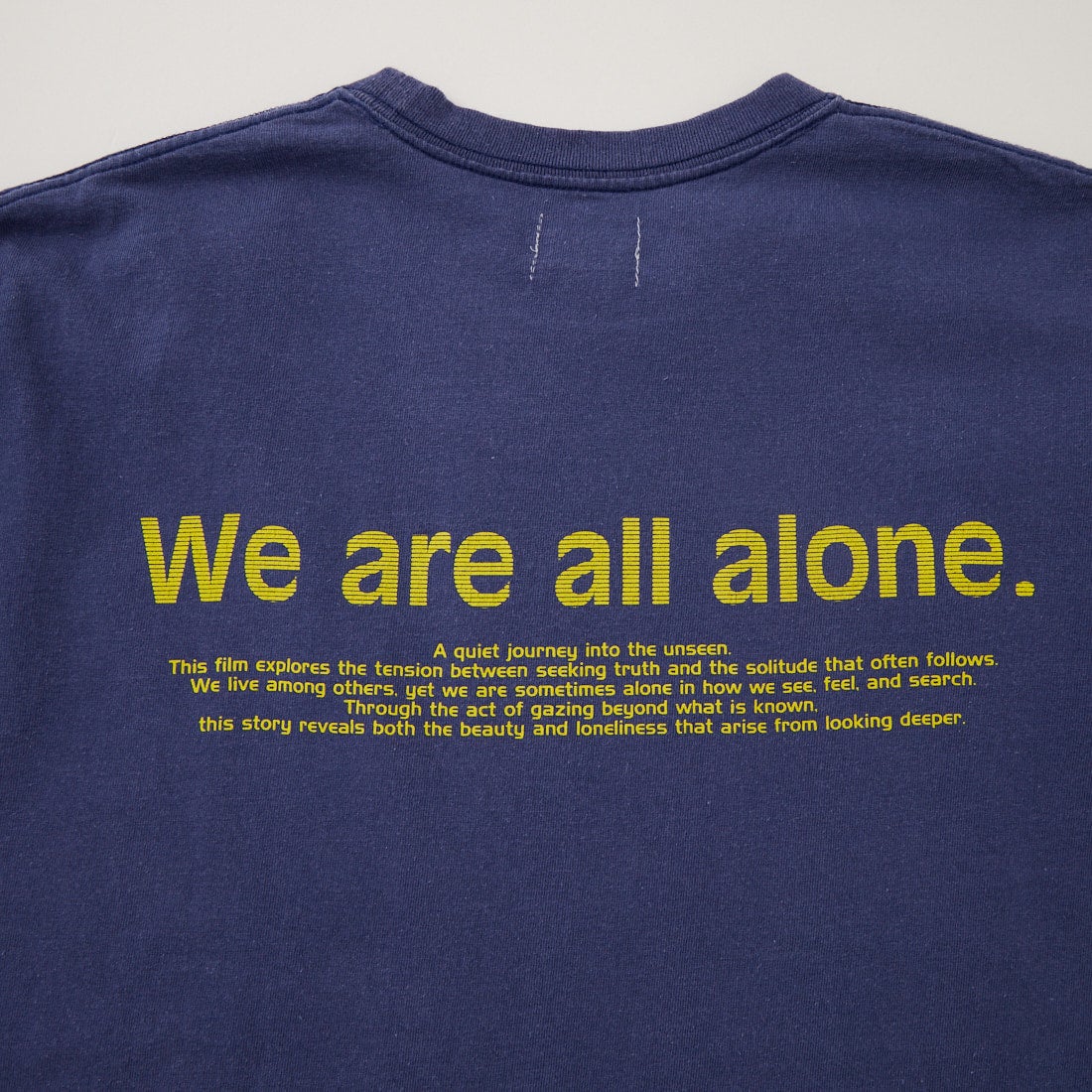 Name. [ネーム] WE ARE ALL ALONE ルーズフィットプリントTシャツ [NMCU-058] BLUE