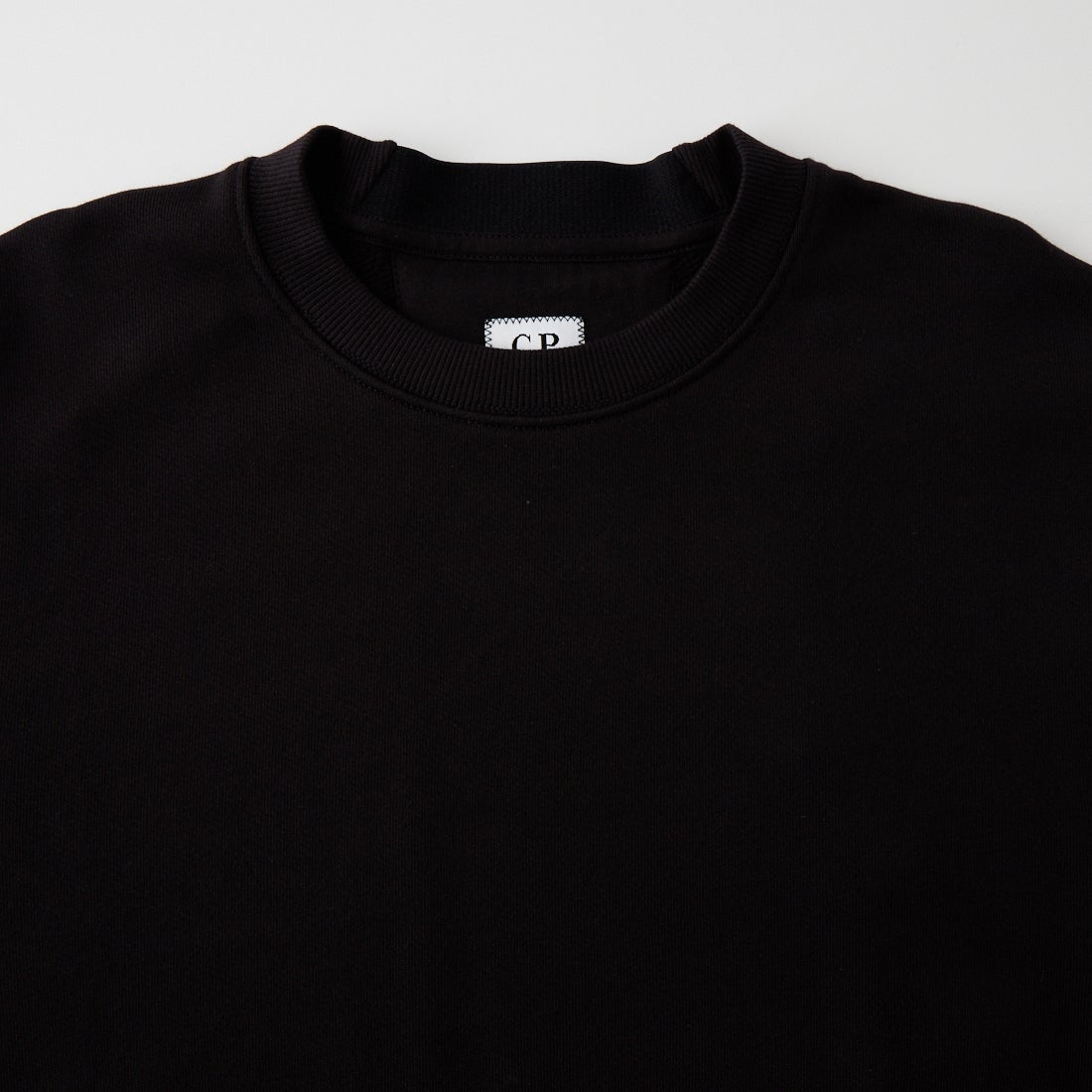 C.P.COMPANY [シーピーカンパニー] 起毛フリース レンズ クルーネックスウェットシャツ [RCCMSS713A] 999 BLACK