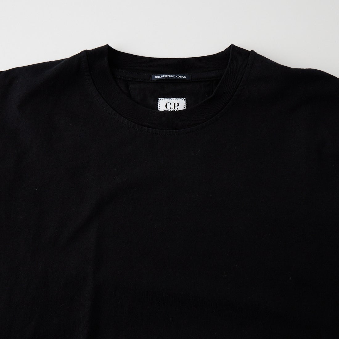 C.P.COMPANY [シーピーカンパニー] 30/2 シルケット天竺 ツイスト レンズTシャツ [21CMTS100A] 999 BLACK
